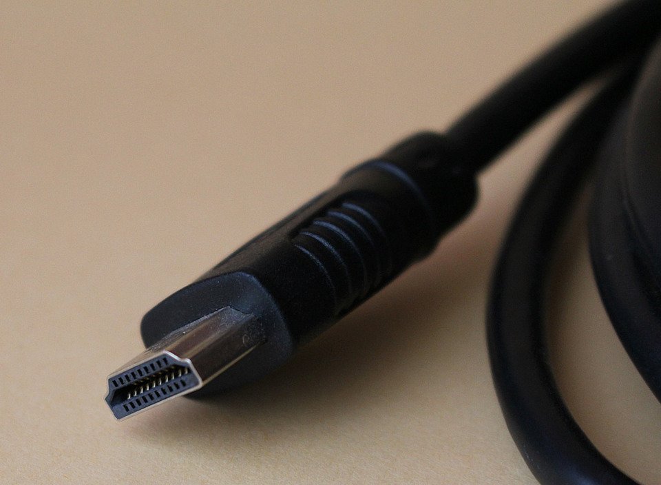 HDMI, the best way to route your audio.

Picture of a black HDMI cable on a beige table.