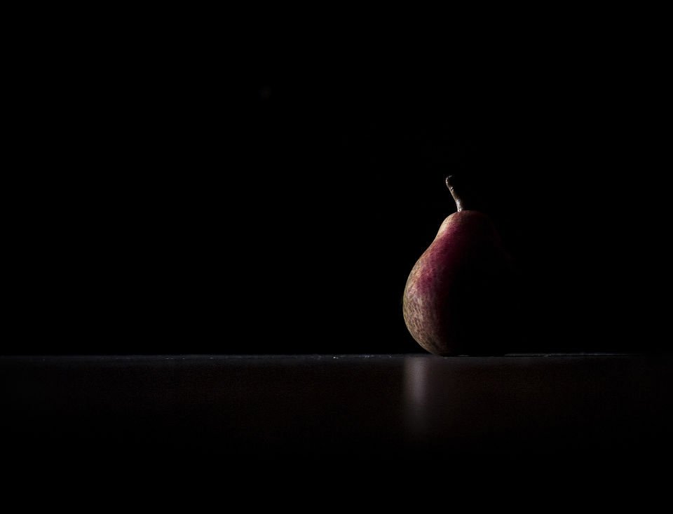 low key lighting  of a pear